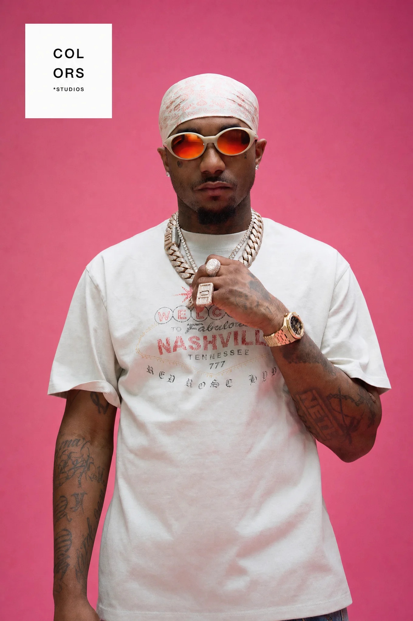 Loe Shimmy portrait against a pink background
